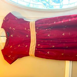 Burgundy color with gold trim . Very comfortable. No itchy lace or trim.